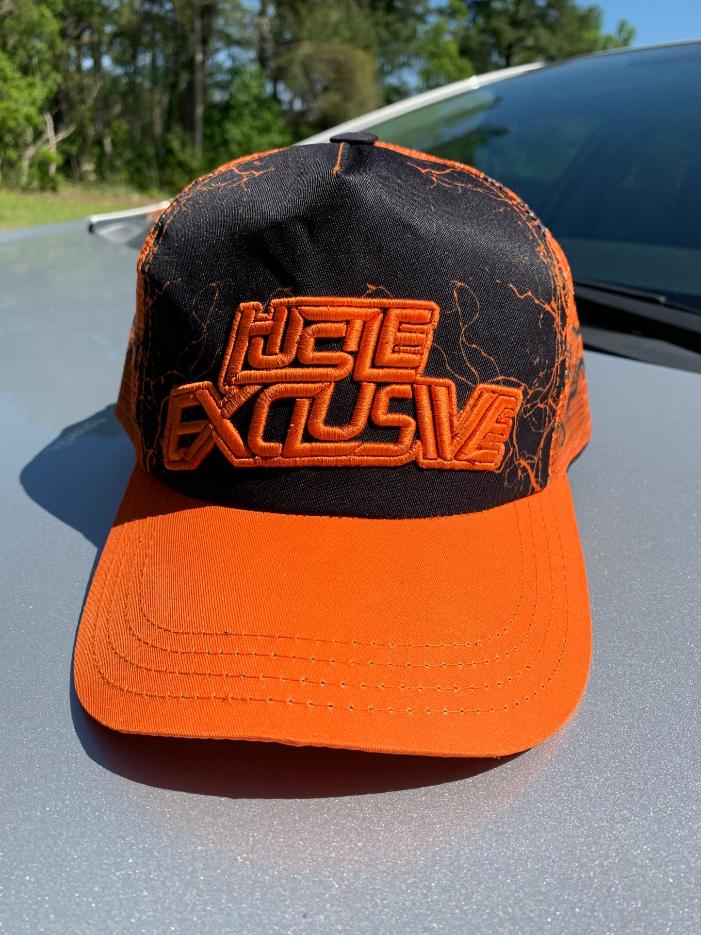 Hustle Exclusive Graphic "Dark Orange & Black" Trucker Hat